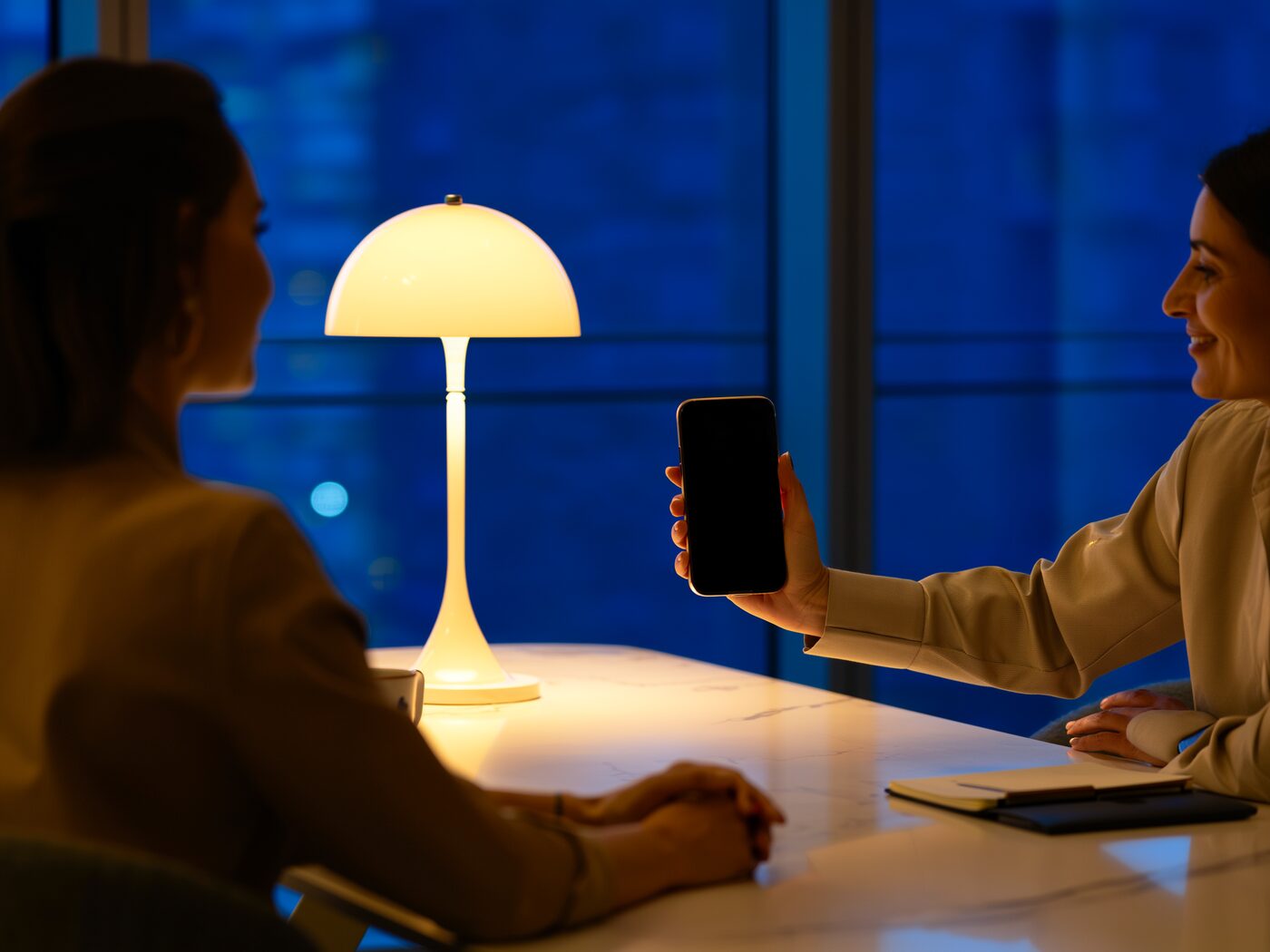 A listing appointment at a dining table in the evening