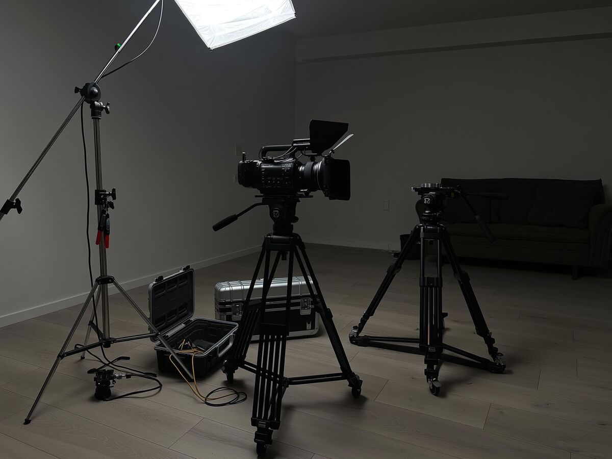 Video production gear set up in an empty living room